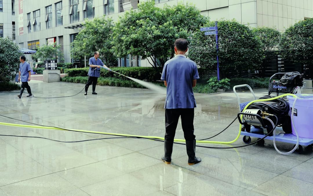 Pressure washing a paved driveway surface
